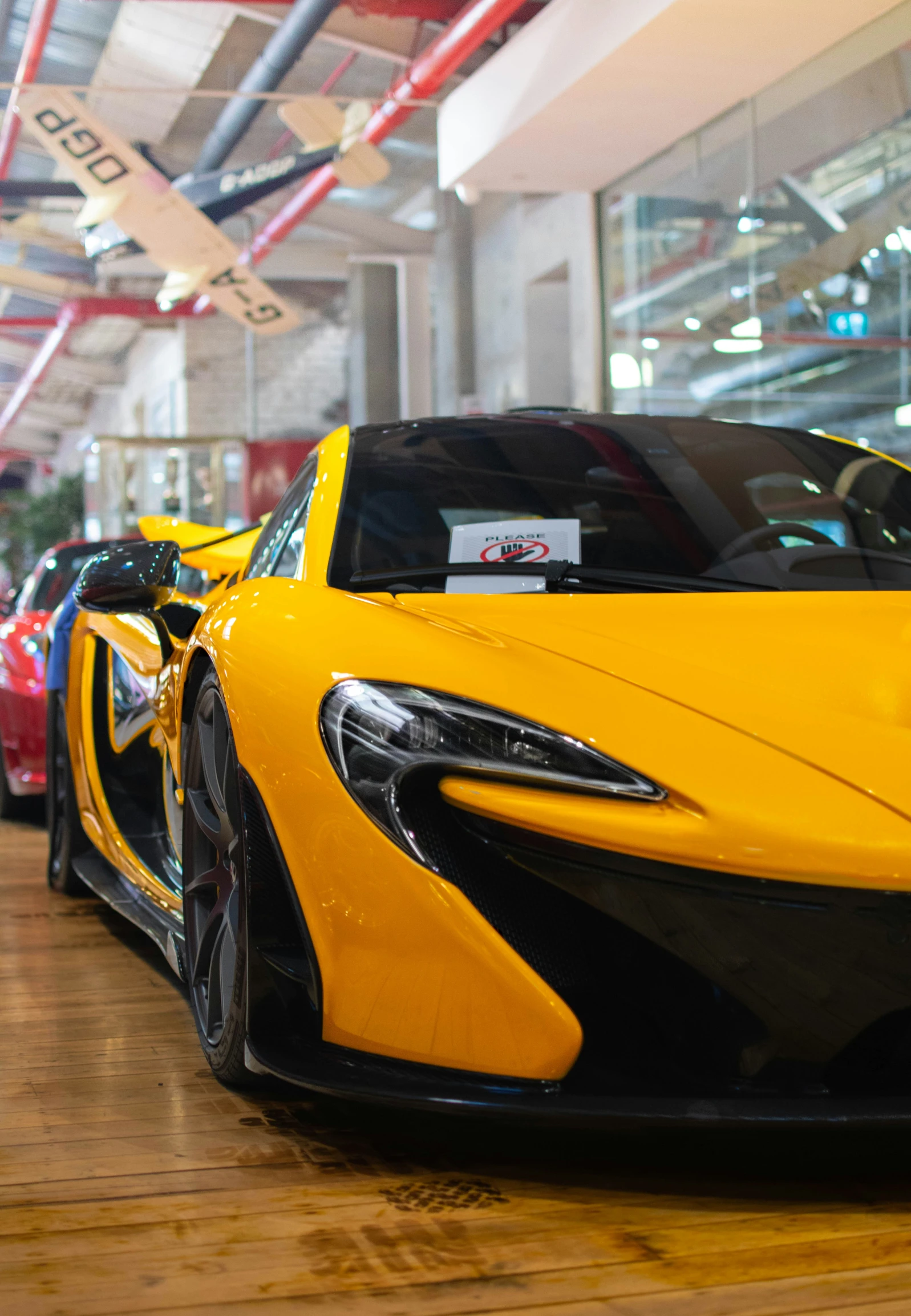 a row of yellow and black sports cars on display