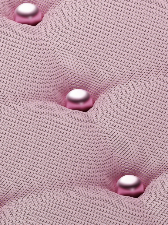 two metallic objects on top of pink fabric