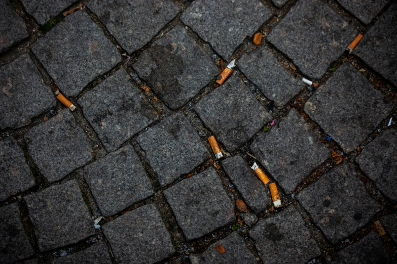 a group of cigarettes laying on the ground