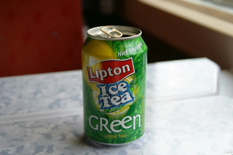 a can of ice tea is sitting on a counter