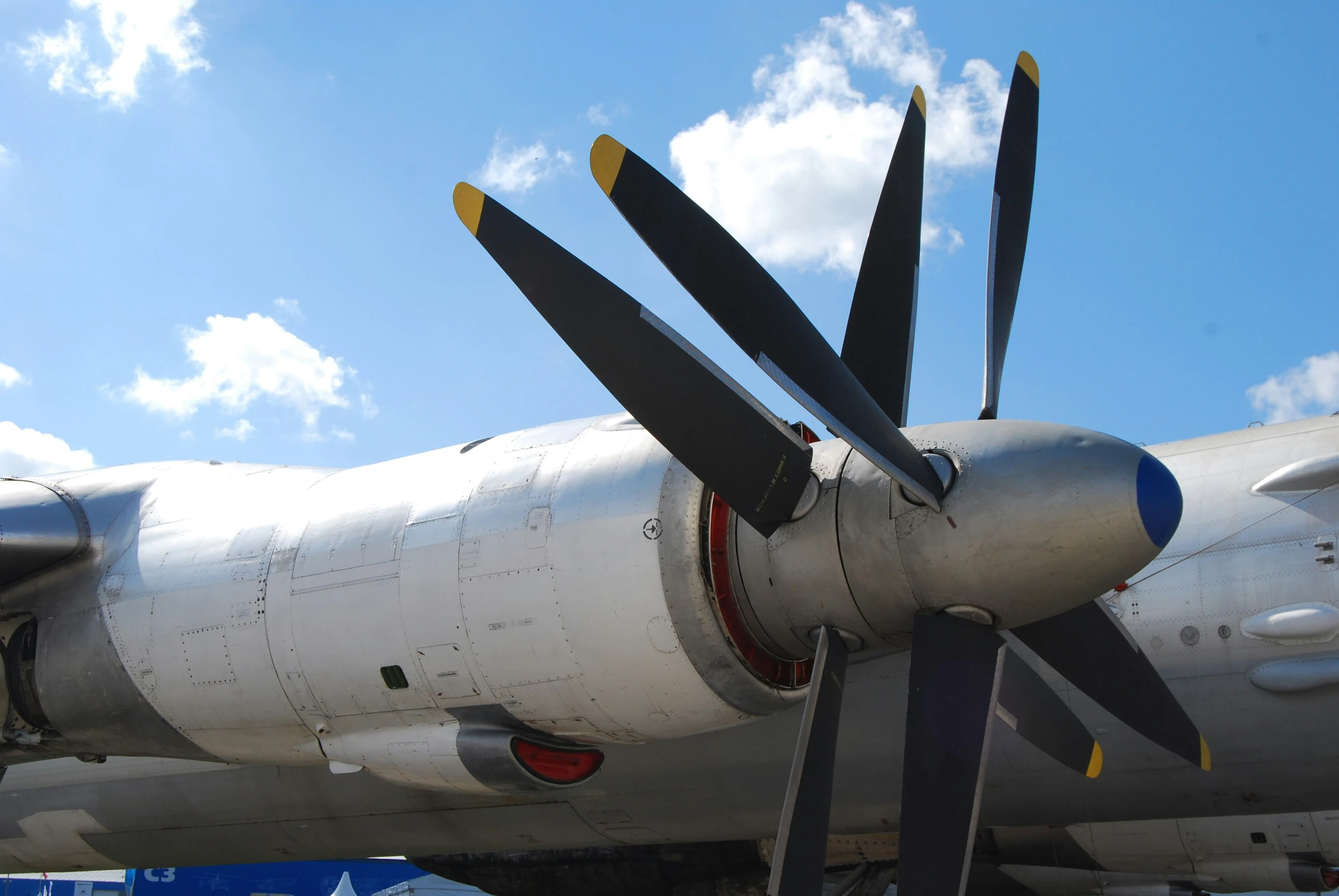 an old propeller airplane is being displayed