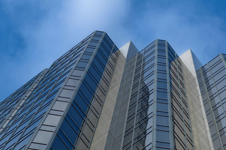 the side of a tall building with multiple windows