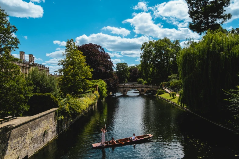 a small boat on a canal in a city