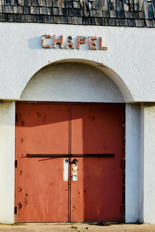 the doors to the chapel are red and open