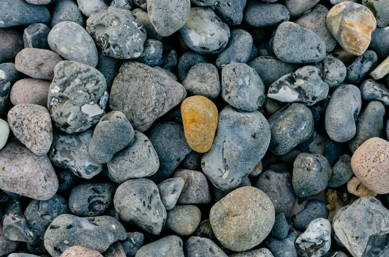 a rock with yellow rocks on top of it