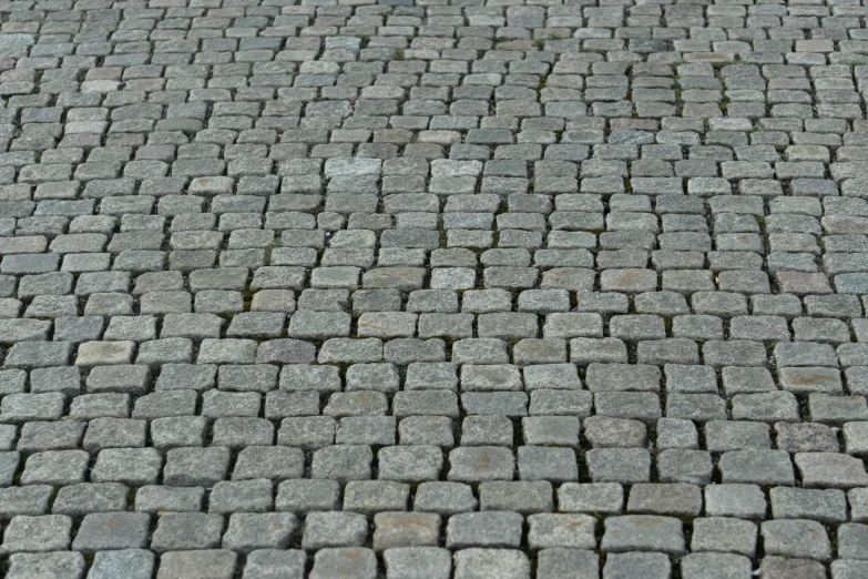 some gray rocks and cement near one another