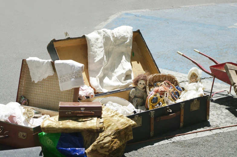 a suitcase is piled up in the road