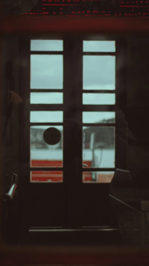 a close up of a door in a building with windows