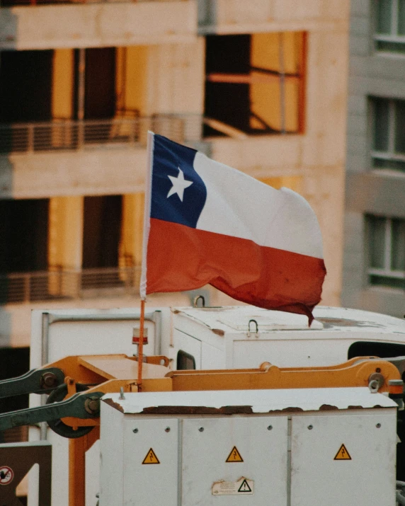a texas state flag is in the back of a dumpster