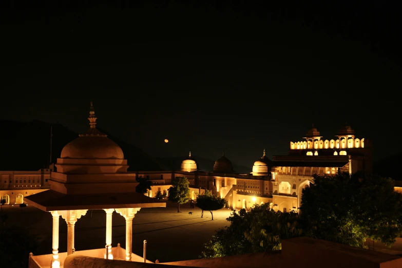 lit up palace building in the dark at night