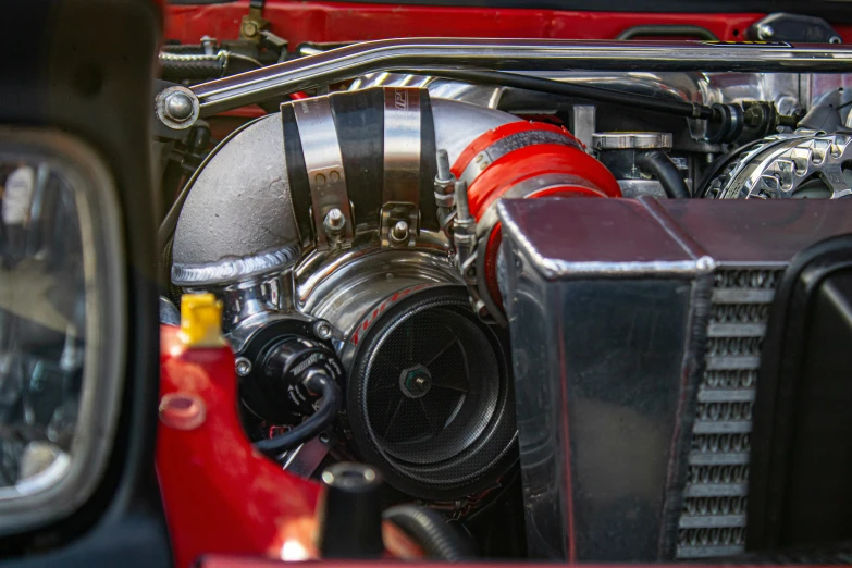 a close up of a red sports car engine