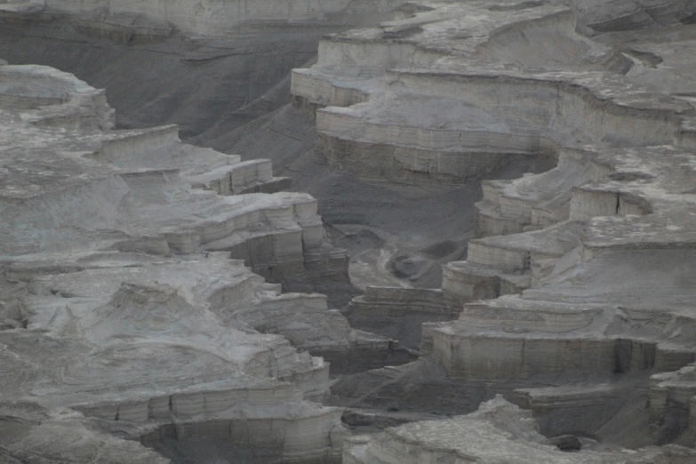 a snowy mountain landscape with white cliffs