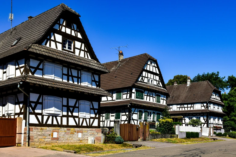 a couple of big wooden buildings that have windows on them