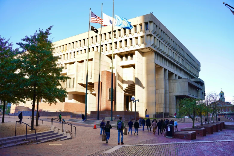 a large building with two flags on top of it