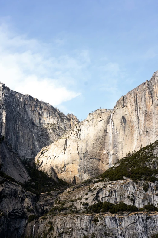 a large rocky cliff face on a mountain