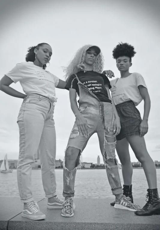 three young ladies standing next to each other