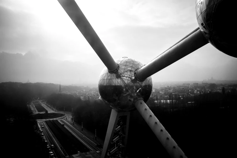 an aerial view of a large structure with multiple poles and a ball on top