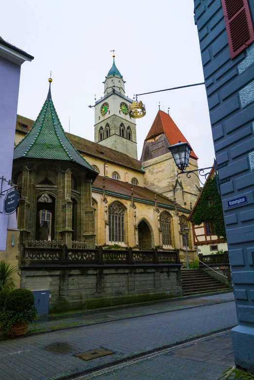 an old church with towers next to buildings