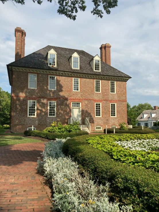 an exterior view of a red brick house