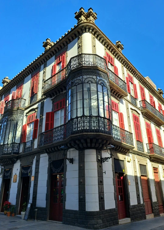 an old building with ornate balconys on top