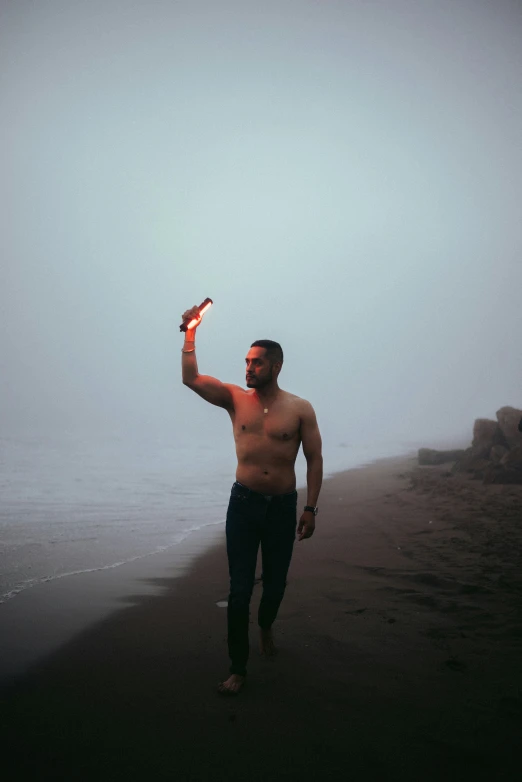 man holding a kite over his right shoulder