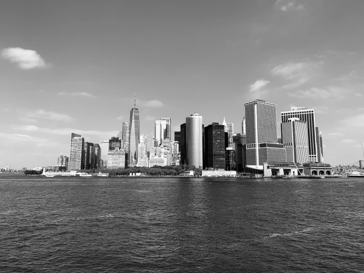 city skyline view across the water in black and white