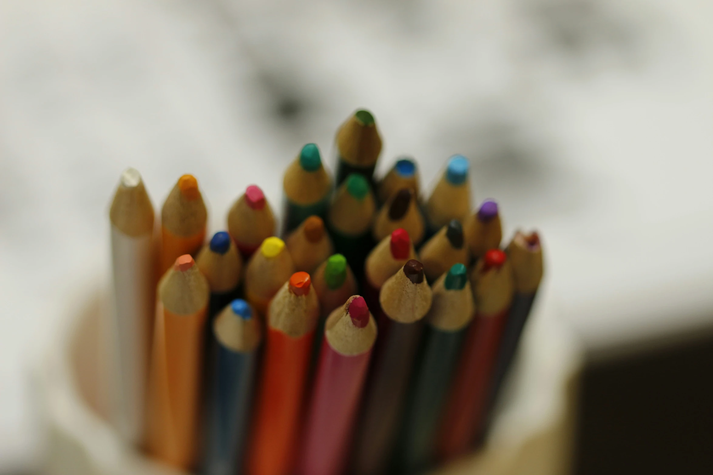 several colored pencils placed side by side