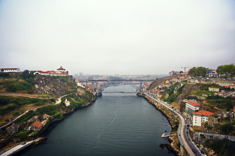 a very pretty waterway next to a big bridge