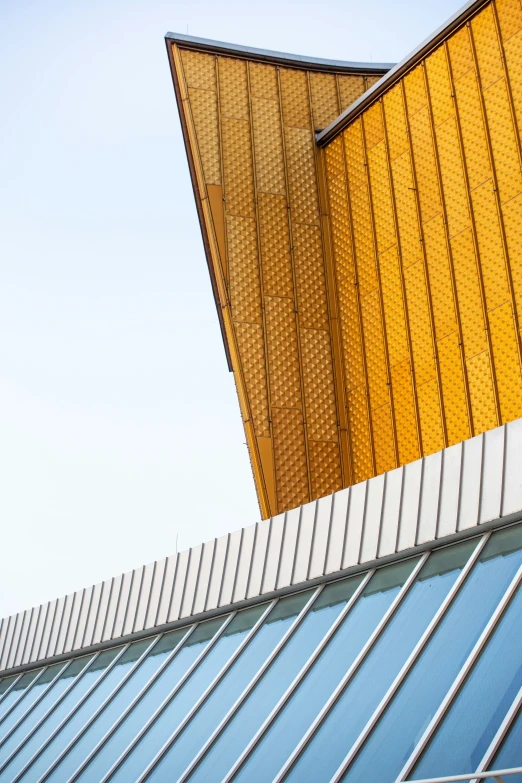 looking up at the side of a building and a clock