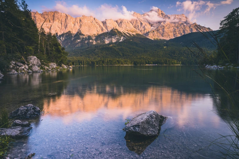 an old fashioned pograph of a lake surrounded by mountains