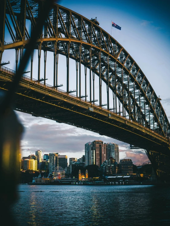 a tall bridge spanning across the width of water