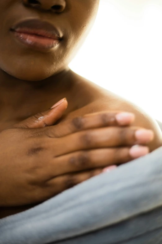 woman holding hand on chest covered in dirt