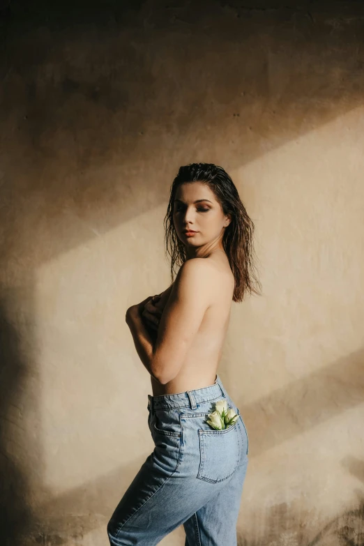 a person with flowers is shirtless in denim