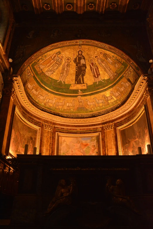 the ceiling of a large building has many paintings