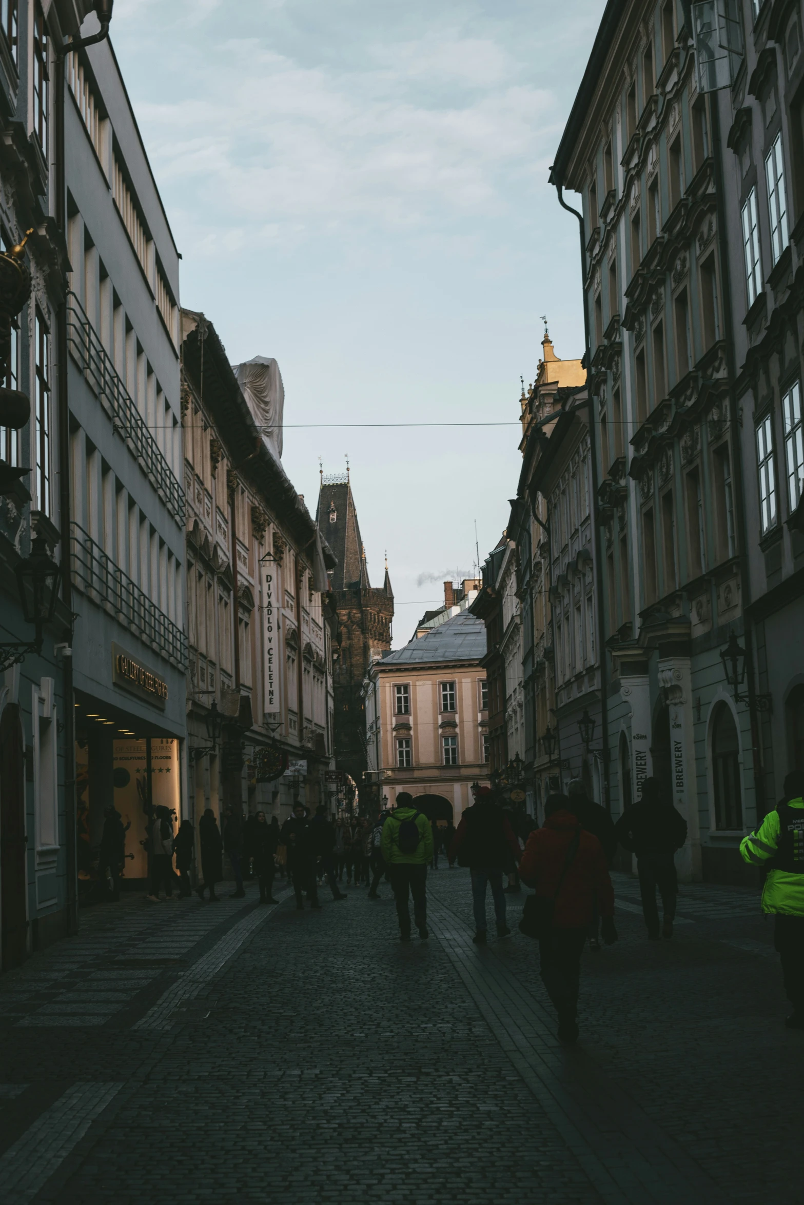 there is a group of people walking down the street