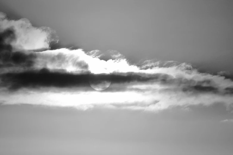 an airplane is flying on a cloudy day