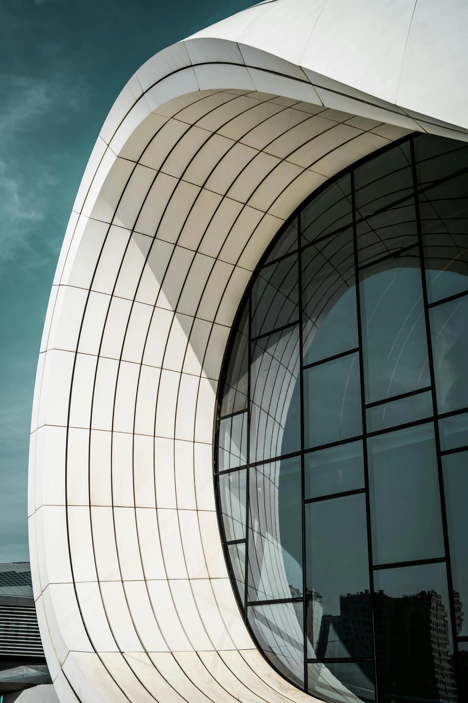 a building is made up of curved glass