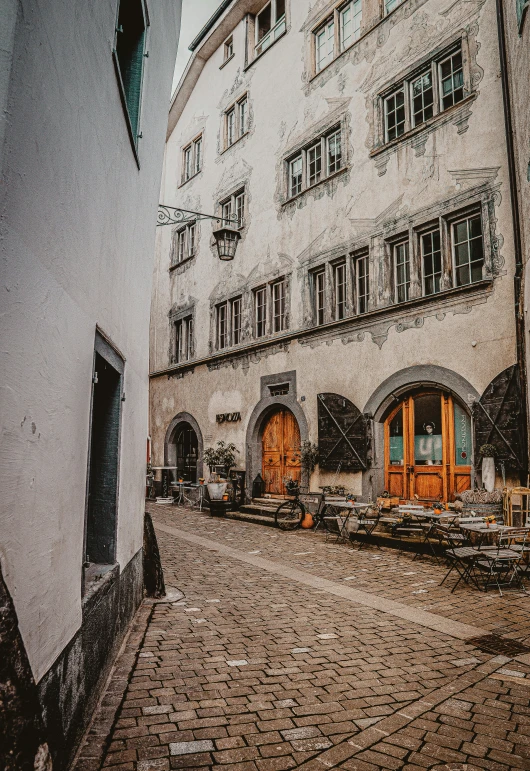 a drawing of an old fashioned street in front of an apartment building