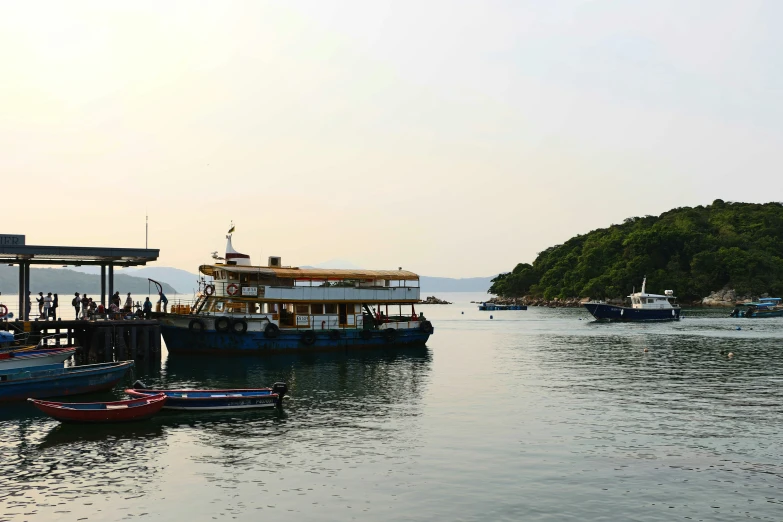 there are several small blue boats on the water