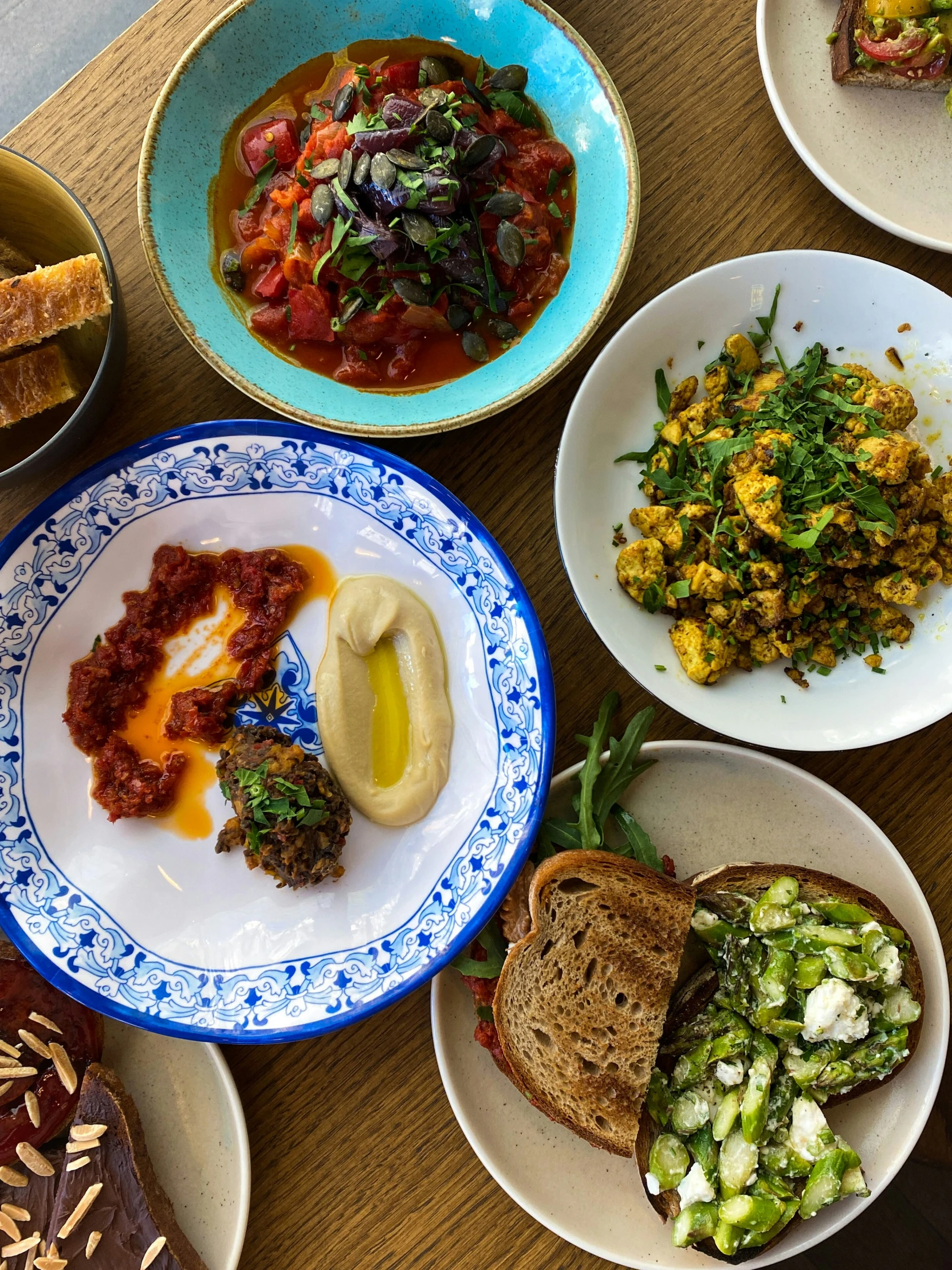 bowls of food on a table, with other plates