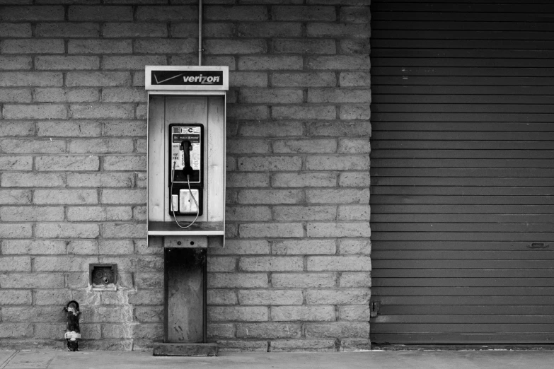 an old phone that is attached to a wall