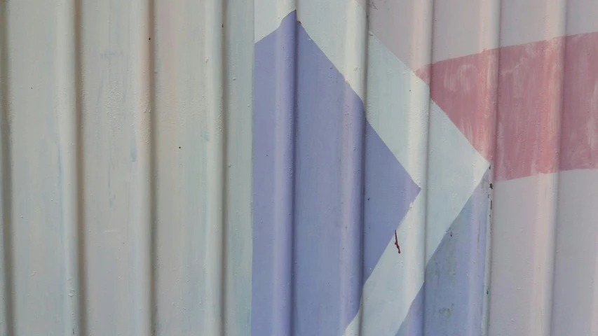 the background is made up of metal panels with pink, purple and white stripes