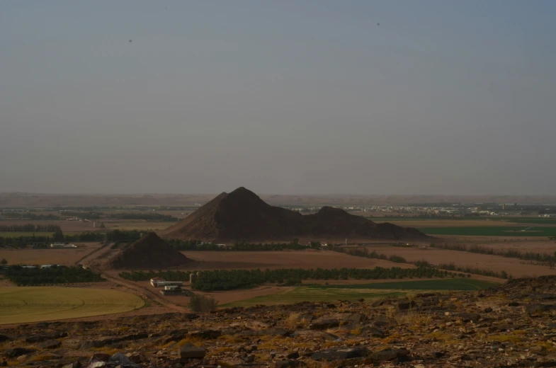 the dirt hills look like they are in some kind of wilderness