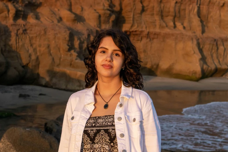 an image of a woman posing for a pograph at the beach