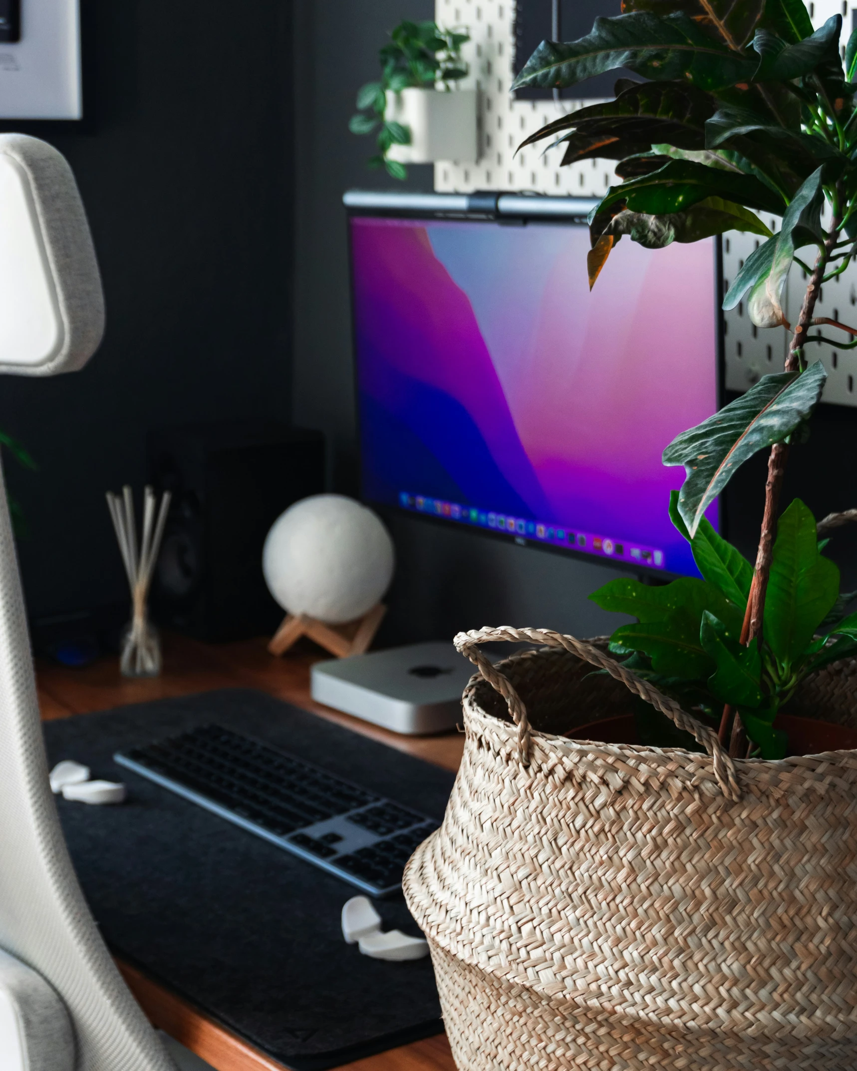 computer screen sitting on top of wooden desk in home