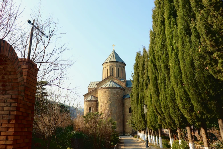 an alley with a castle style building in the background