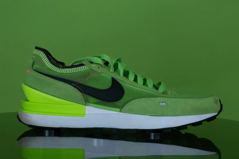 the nike air zoom react fly sneaker has an overgreable green design