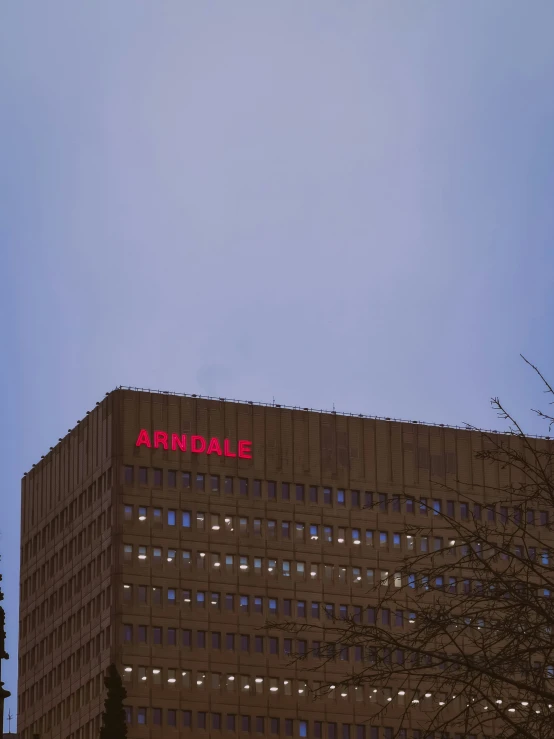 a very tall building sitting next to trees