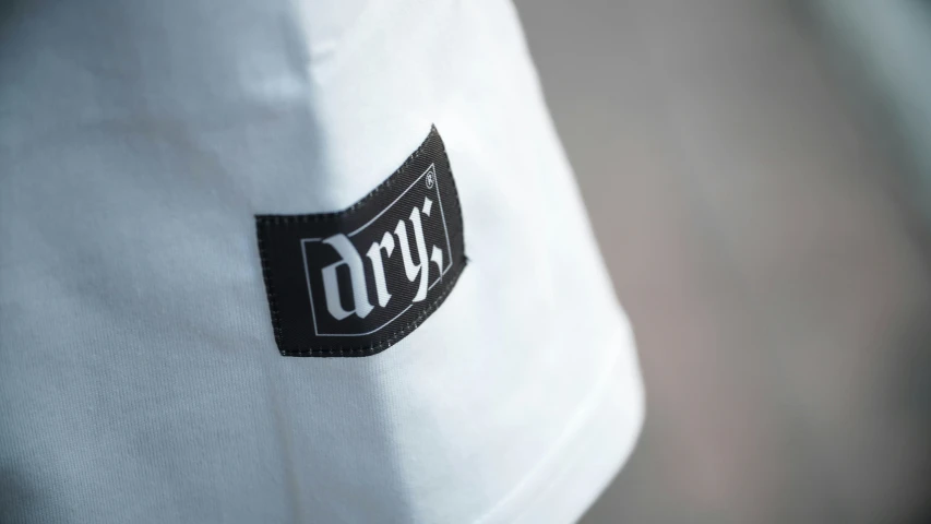 a close up image of the logo on a white jacket