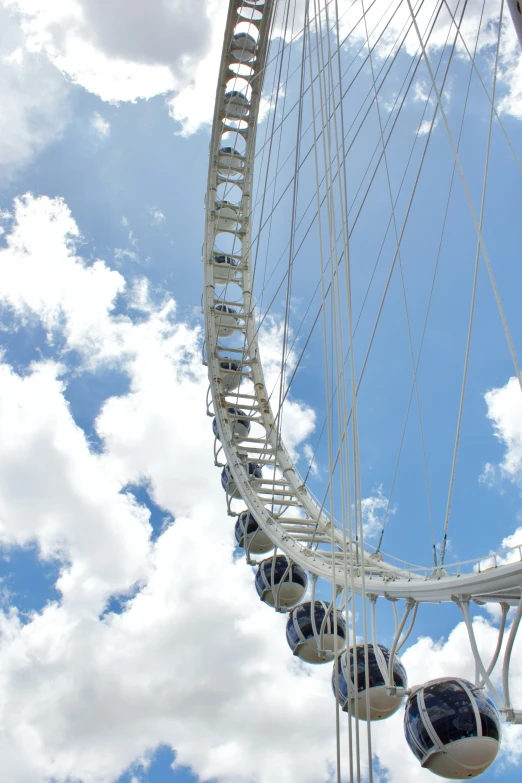 a ferris wheel with balls on it in the sky